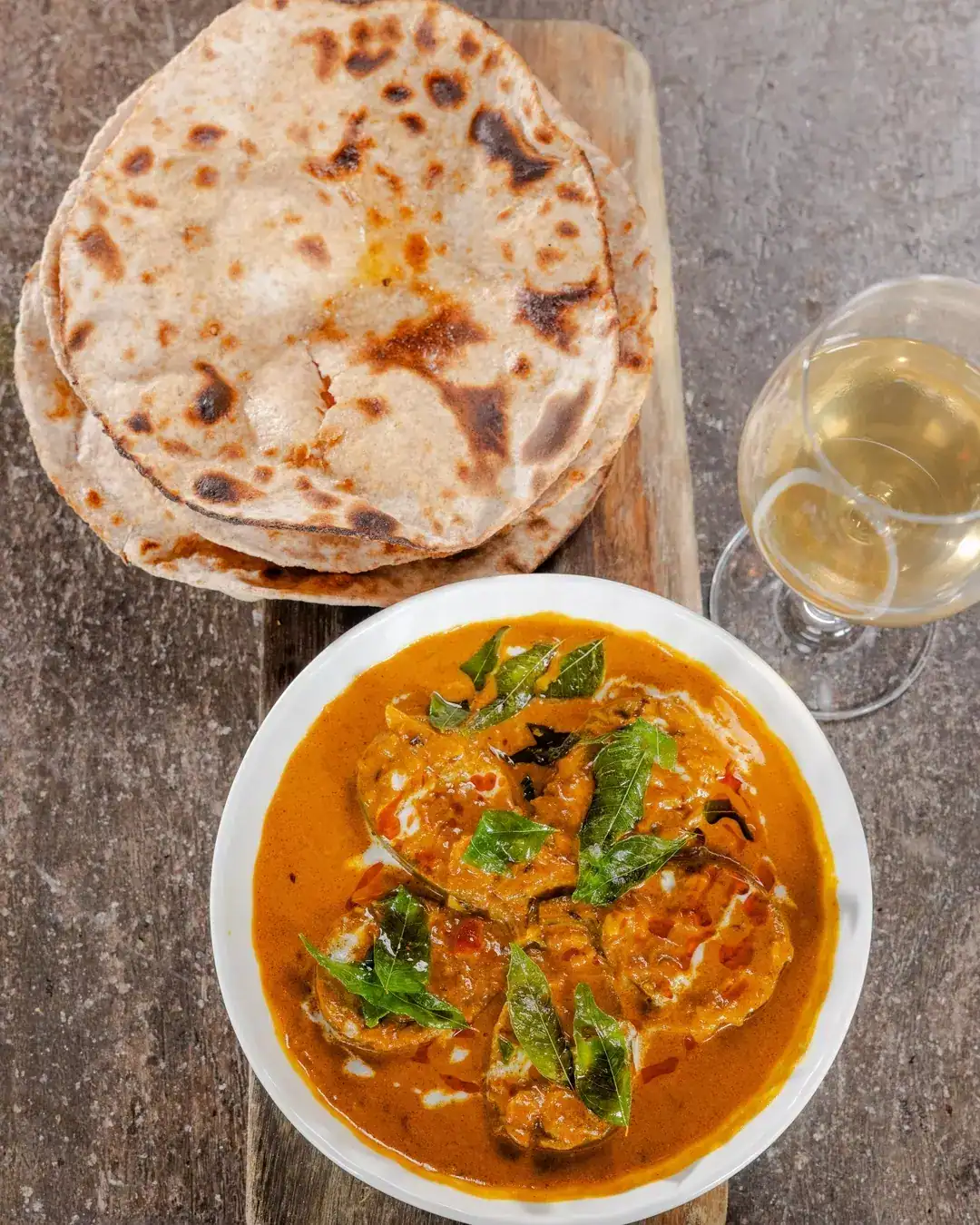 eggplant curry served with naan