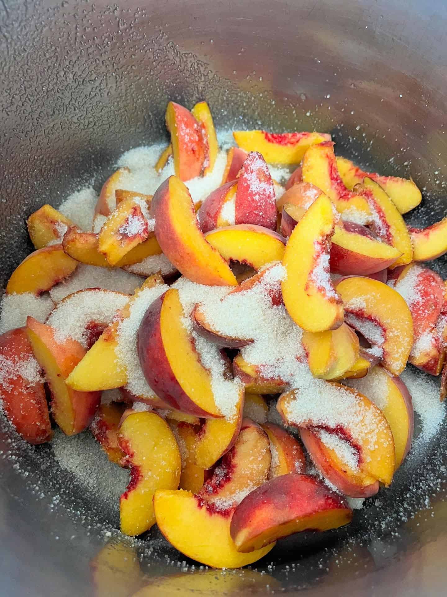 fresh peaches with sprinkles of sugar 