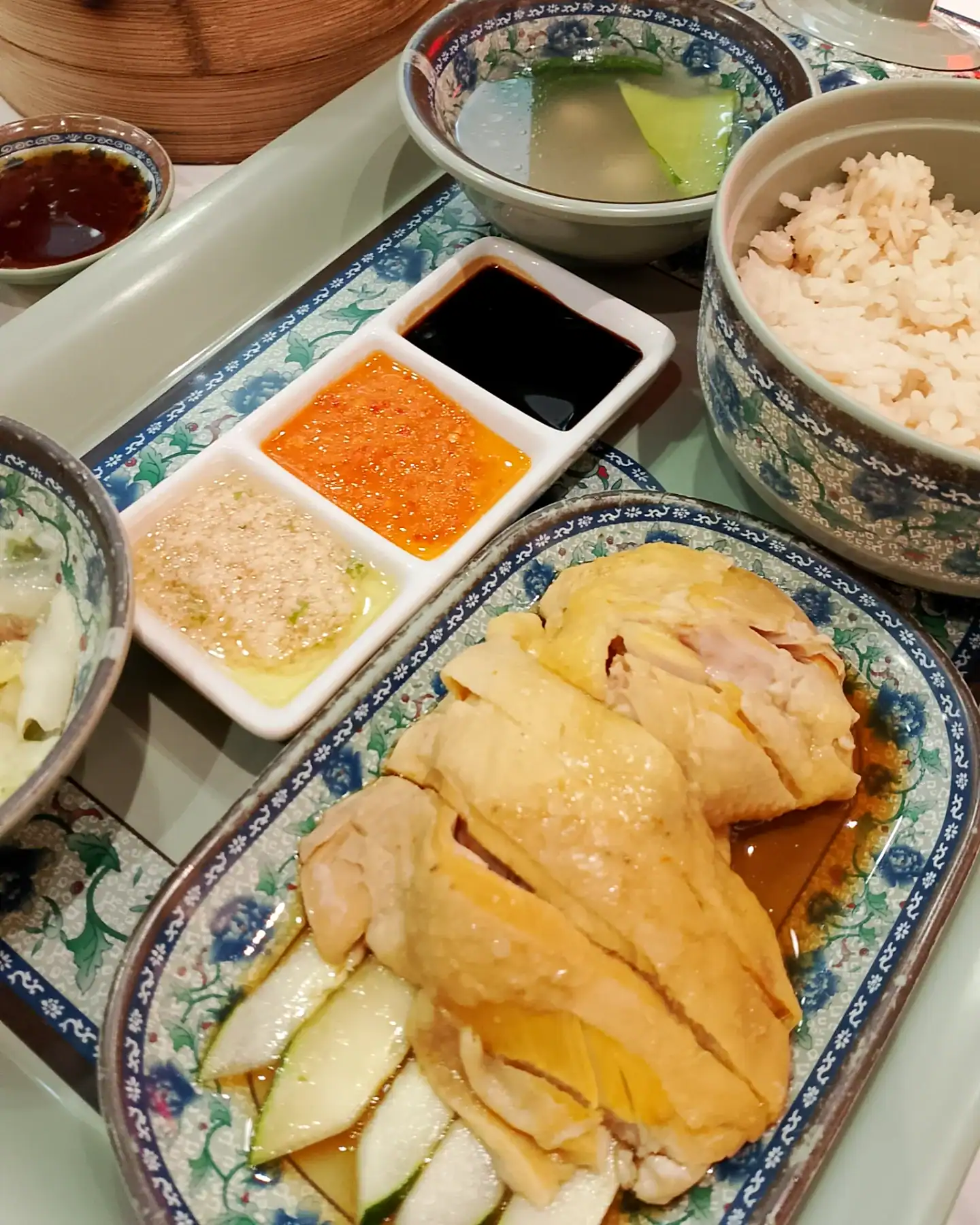 hainanese chicken rice served with three dipping sauces