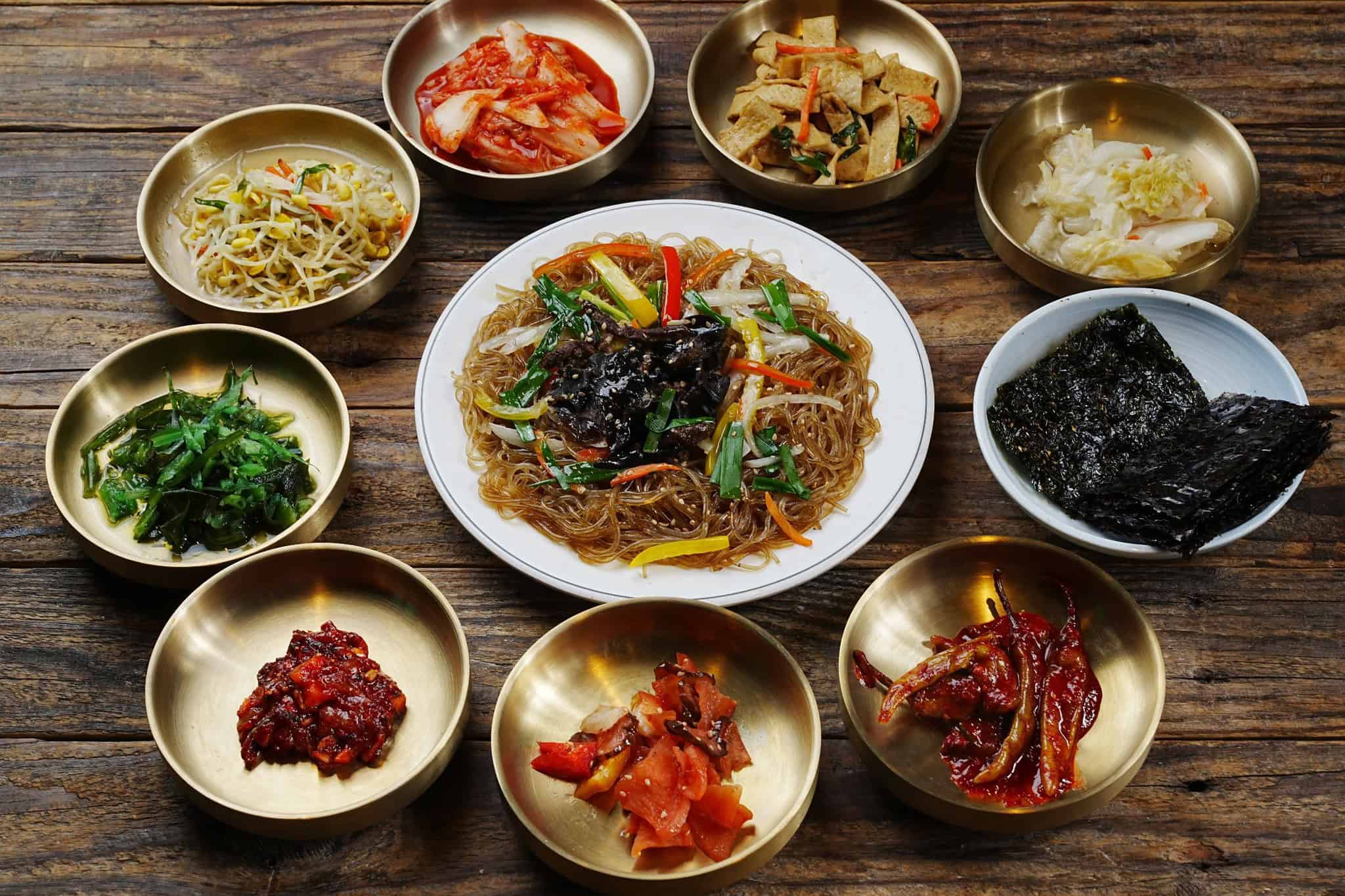 japchae-with-banchans japchae served with banchans (side dishes)