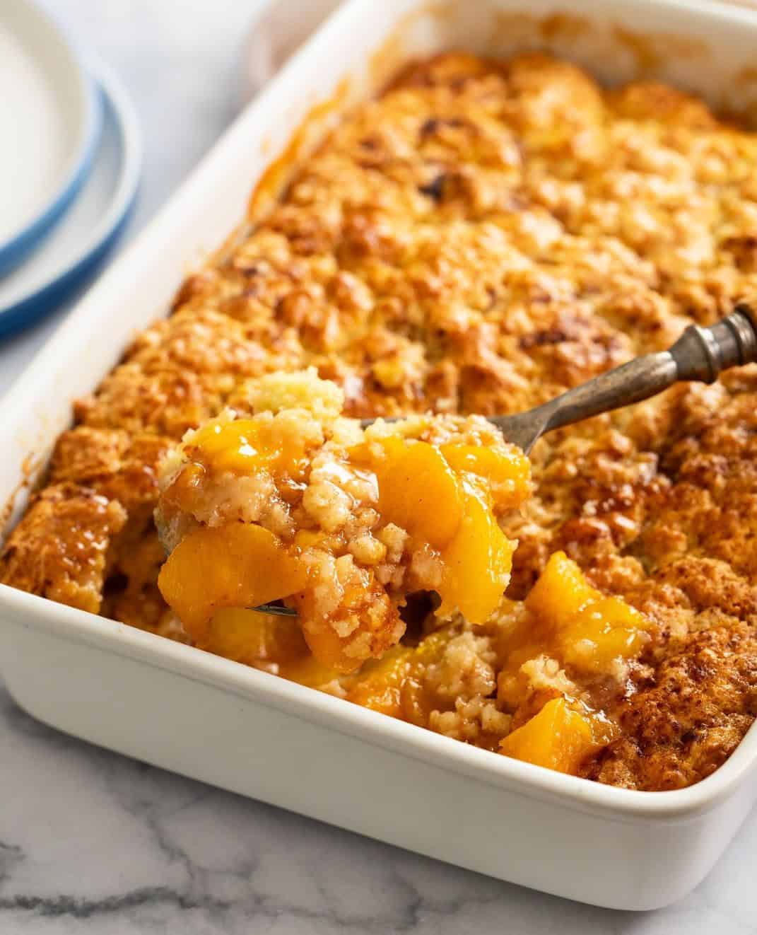 peach cobbler in a baking dish