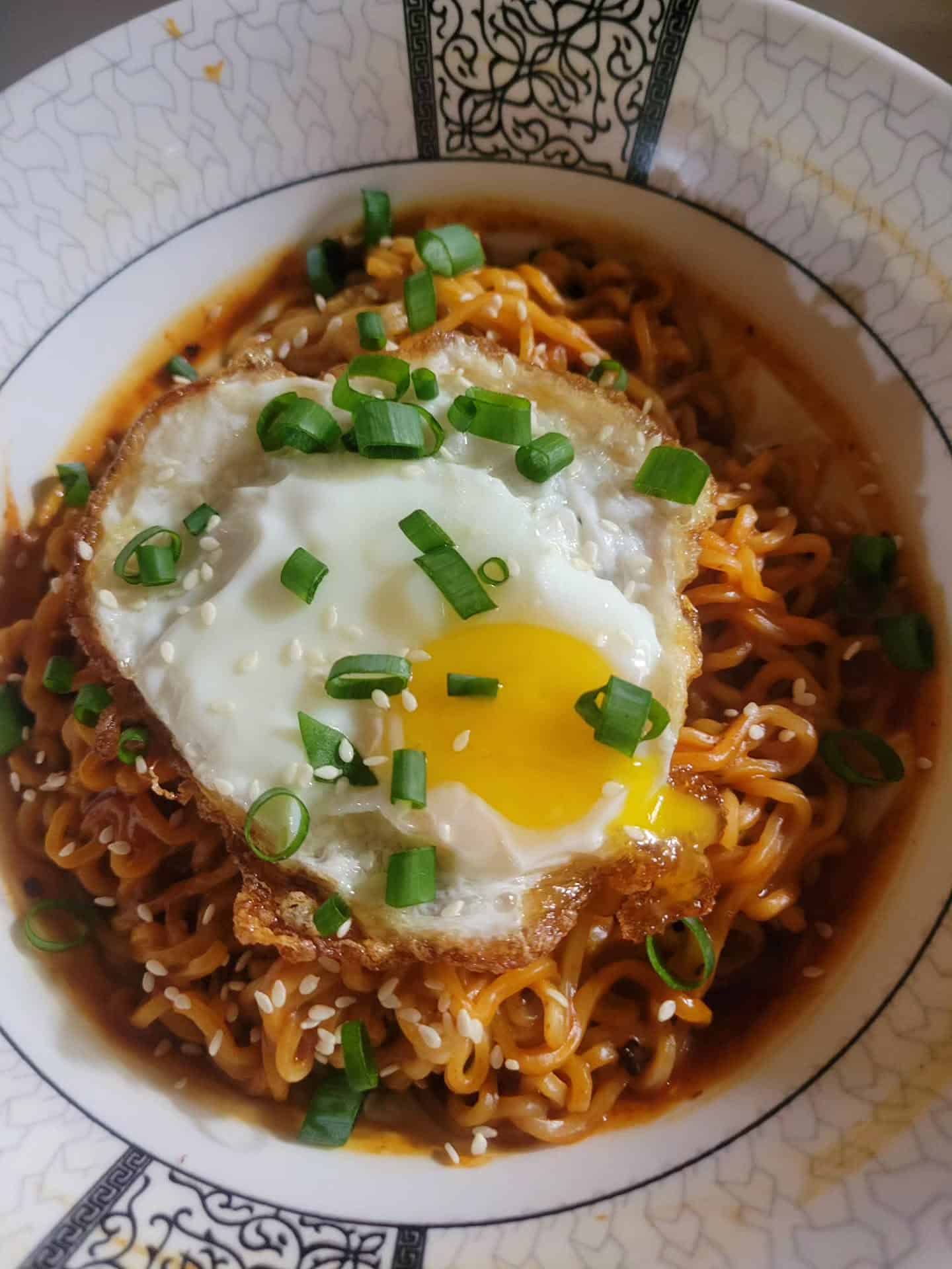 peanut noodles topped with fried egg